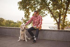 Morning walk of young male and gold labrador dog photo