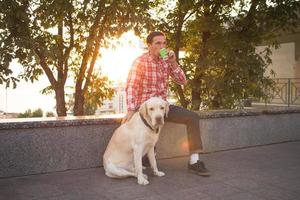 Morning walk of young male and gold labrador dog photo