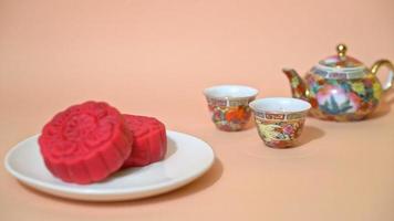 Chinese moon cake strawberry red bean flavour on wood plate video