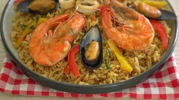 Seafood Paella with prawns, clams, mussels on saffron rice - Spanish food style video