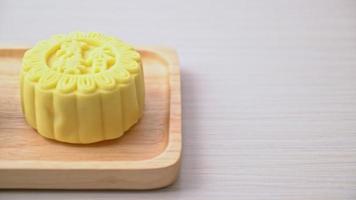 Chinese moon cake custard flavour with tea on wood plate video