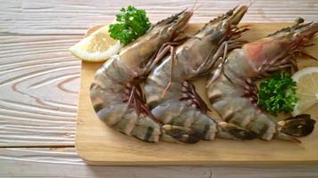 fresh tiger prawn or shrimp on wood board video