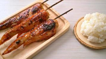grilled or barbecue chicken wings skewer with sticky rice video