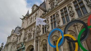 PARIS, FRANCE, September 21, 2021, Paris City Hall, Hotel de ville, getting ready for the Olympic Games in summer of 2024, traditional symbolic emblem white flag with five colored rings
