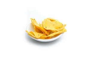 Tortilla chips in small white bowl photo