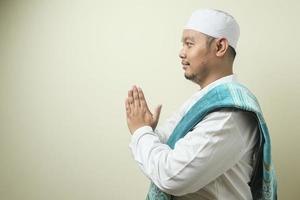 Adult Asian Muslim man gesture in greeting photo