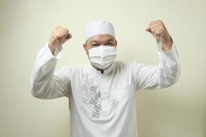 Asian muslim man wearing mask photo