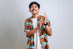 man clapping and applauding happy and joyful, smiling proud hands together photo