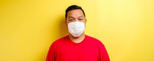 Asian man thumb up and wearing masks to prevent the spread of Corona virus photo