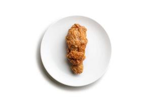 Top view fried chicken leg in white plate photo