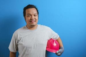 Fat Asian guy wearing a red helmet photo