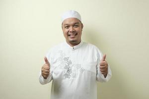 Asian Muslim man smiled looking at the camera photo