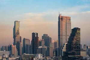 Cityscape of skyscraper of Bangkok city at sunset photo