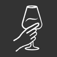 Hand holding glass of wine chalk icon. Glassful of alcohol beverage. Wine service. Glassware. Celebration, party. Wedding. Cheers. Degustation. Toast. Isolated vector chalkboard illustration