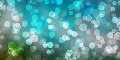 Light Blue, Green vector backdrop with dots.