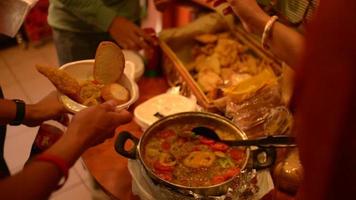 India. Distributing food to poor people video