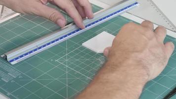 Architecture Designer Man hands work with a Model on Table, cutting a Foam plate video