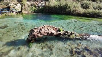 Beautiful natural spring on a sunny day. Wonderful natural colors of green, yellow and blue. Nature monument. Connecting with nature. Water spring. Relaxation and mediation. Prepare your holidays. video