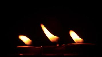 Candle flame on black background video