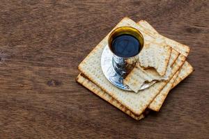 Jewish holiday Passover background with wine and seder plate photo