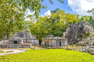 Ancient Mayan site with temple ruins pyramids artifacts Muyil Mexico. photo