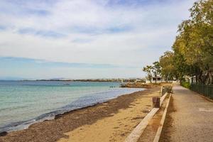 Natural green turquoise water Vouliagmeni Beach near to Voula Greece. photo