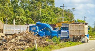 Trucks dump truck excavators and other industrial vehicles Tulum Mexico. photo