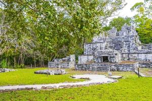 Ancient Mayan site with temple ruins pyramids artifacts Muyil Mexico. photo