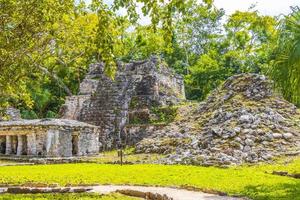 Ancient Mayan site with temple ruins pyramids artifacts Muyil Mexico. photo