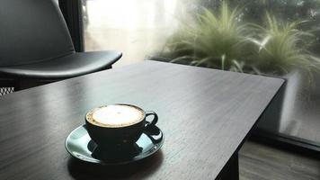 coffee latte on wooden table. photo