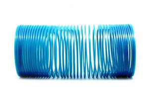 Blue slinky toy Isolated On White Background photo