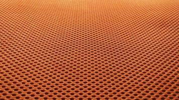 Orange nylon fabric pattern texture background. photo