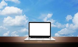 Modern laptop  isolated on sky background. 3D Illustration. photo