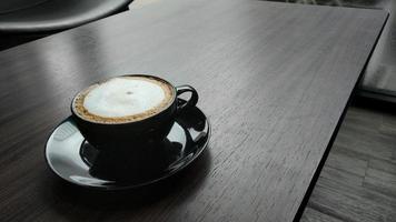 coffee latte on wooden table. photo