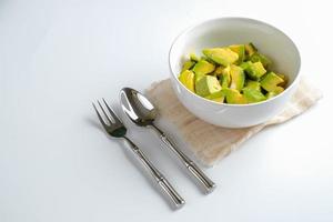 Fresh sliced avocado in white bowl photo