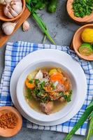 Indonesian traditional culinary, called sop buntut or oxtail soup photo