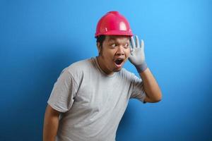 Fat Asian guy wearing a red helmet photo