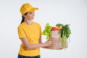 Female food delivery worker with food package photo