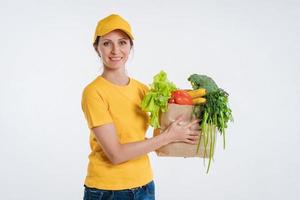 Female food delivery worker with food package photo