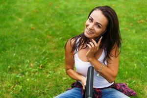 Caucasian woman thinks and writes notes in a notebook, attractive photo