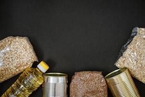 Grains on a black background, the concept of donation photo