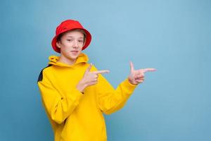 Pointing gesture to side with your finger. Rapper. Information banner. Stylish photo