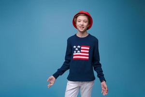 Portrait of young handsome hipster man in blue sweater with usa flag and photo