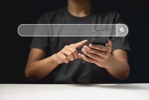 Man's hands are using a smartphone to Searching for information photo