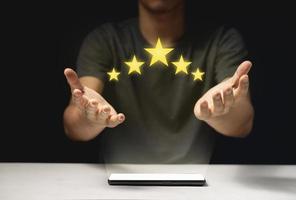 Man Giving Positive Review for Client's Satisfaction Surveys.giving a five star rating photo