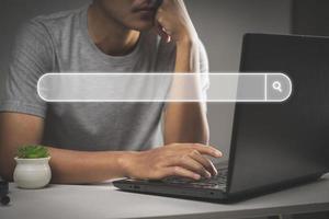 Man hands are using a computer notebook to Searching for information. Using Search Console photo