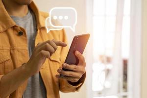 Man hand typing on mobile smartphone, Live Chat chatting on mobile app, social network photo
