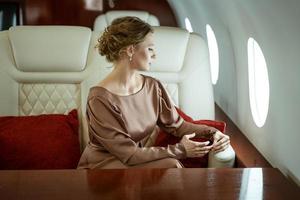 attractive woman on a private jet photo