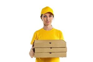 Woman in yellow pizza delivery girl on white background photo