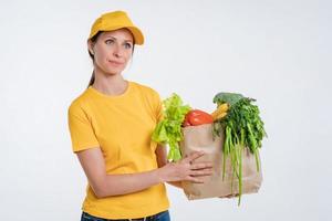 Female food delivery worker with food package photo